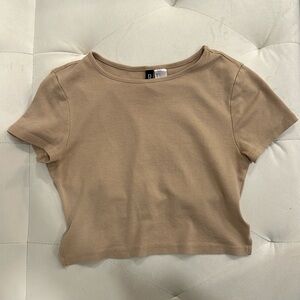 Tan tie-in-the-back crop top.